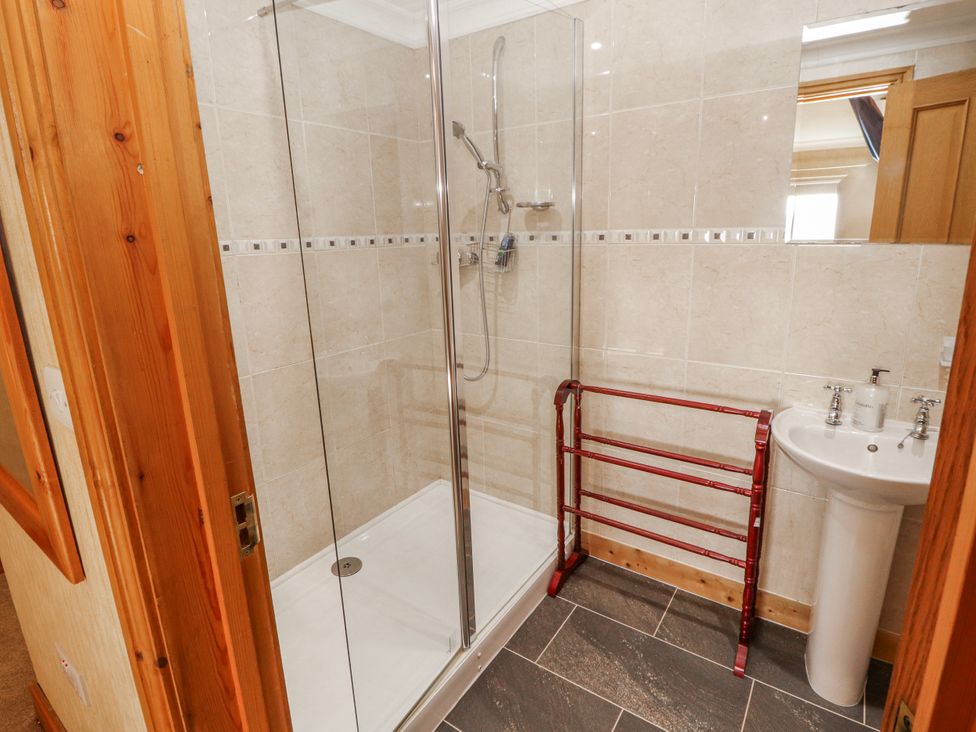 A bathroom with a shower and sink at Old Riggs Paddock Penrith