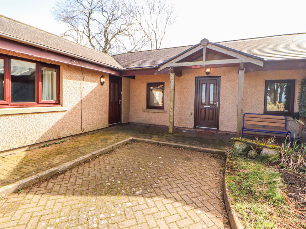 An outdoor area with a pathway and benches at Old Riggs Paddock in Penrith