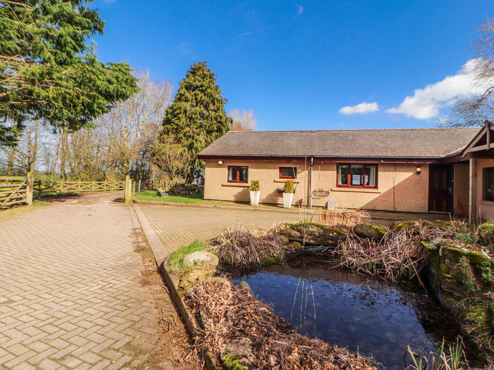 A building with windows and a pond at Old Riggs Paddock in Penrith