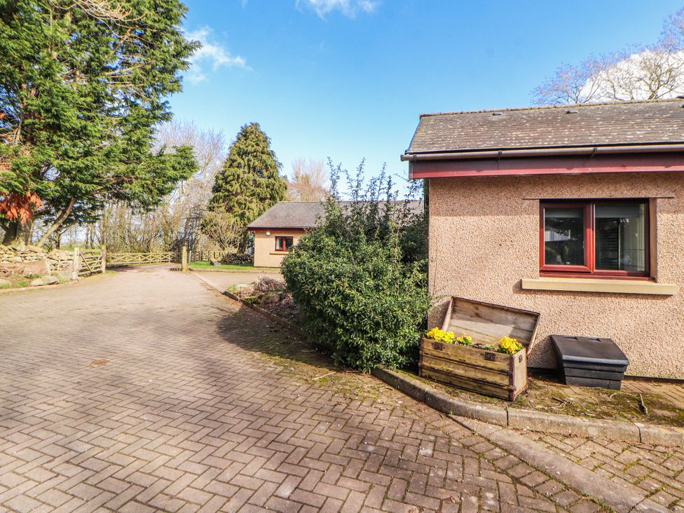 An outdoor area with a building and trees at Old Riggs Paddock in Penrith
