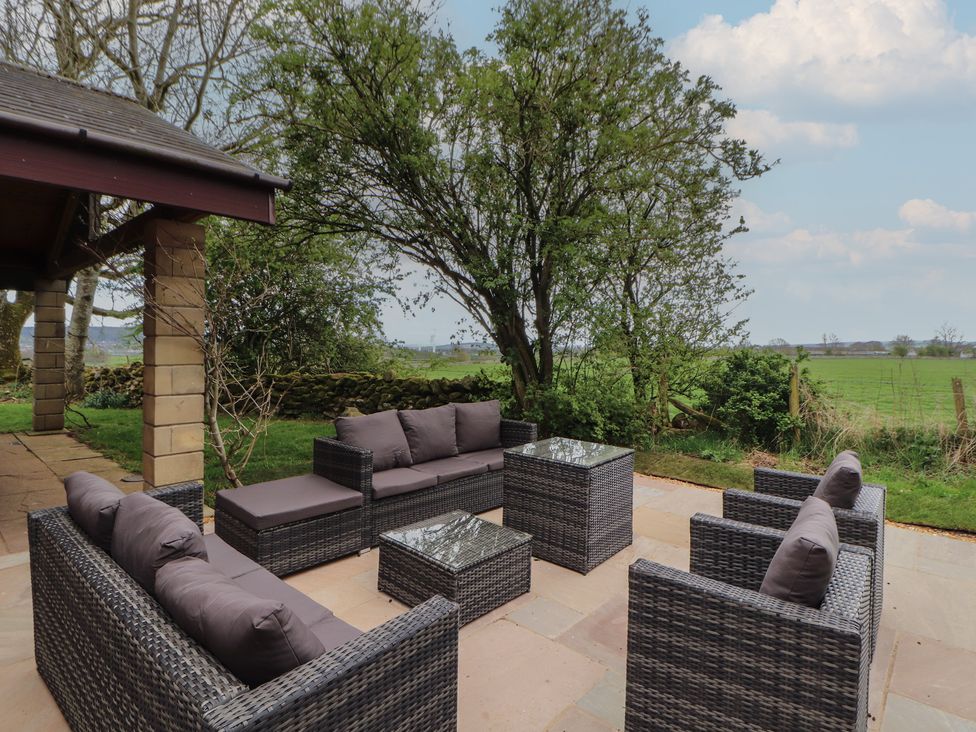An outdoor seating area with furniture at Old Riggs Paddock near Penrith