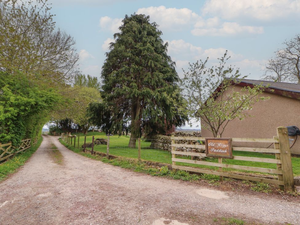 An outdoor area with a path and a sign at Old Riggs Paddock near Penrith