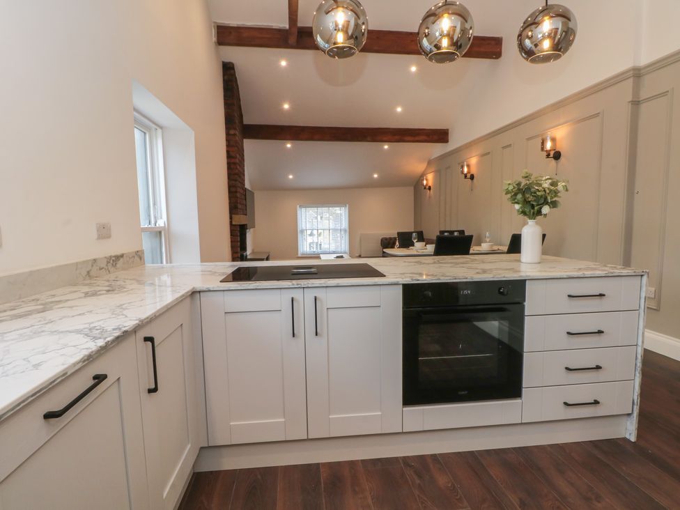 A kitchen with a counter and oven at The Penthouse at 86 Rossendale