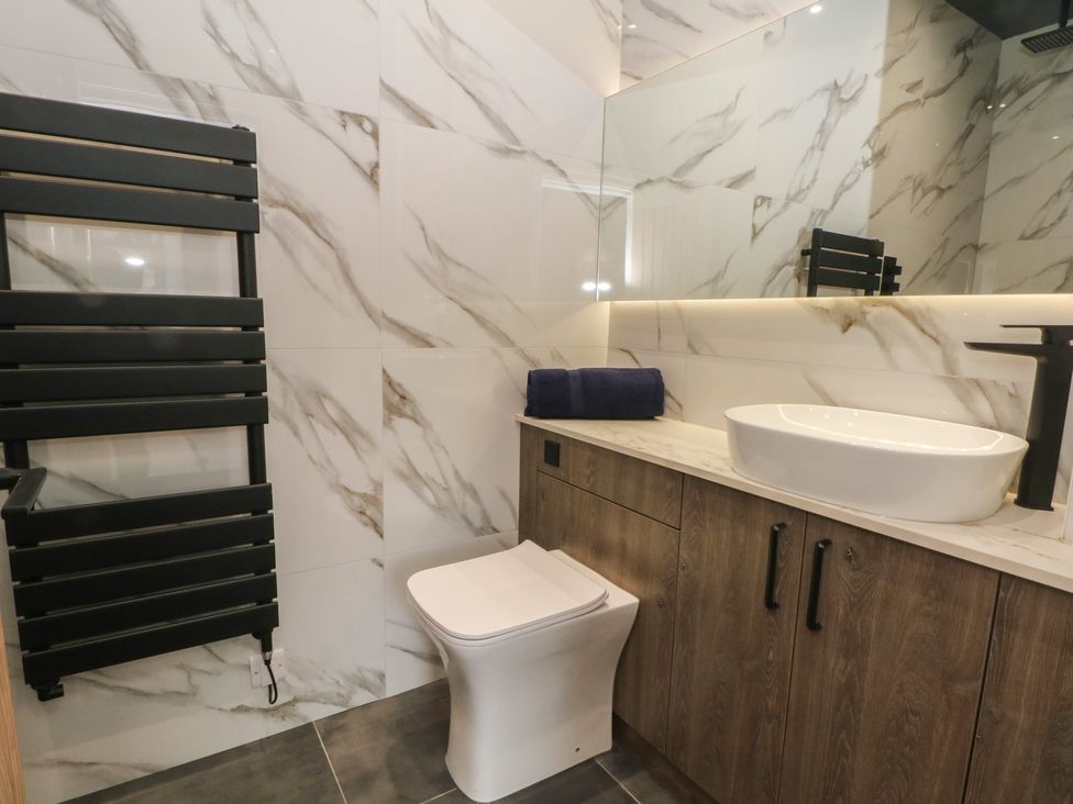 A bathroom with sink and toilet at The Penthouse at 86 Rossendale