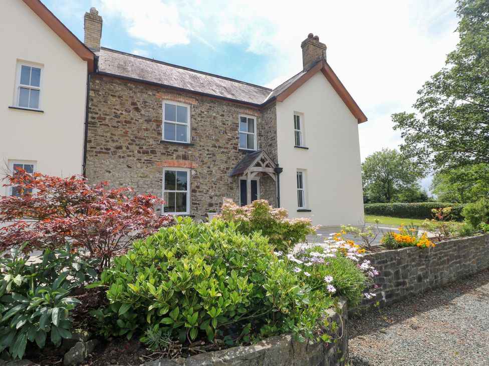 A house with a garden and flowers at The Sycamores in Llawhaden near Narberth