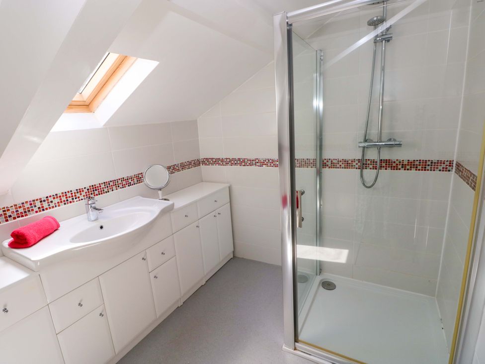 A bathroom with a sink and shower at The Sycamores in Llawhaden near Narberth