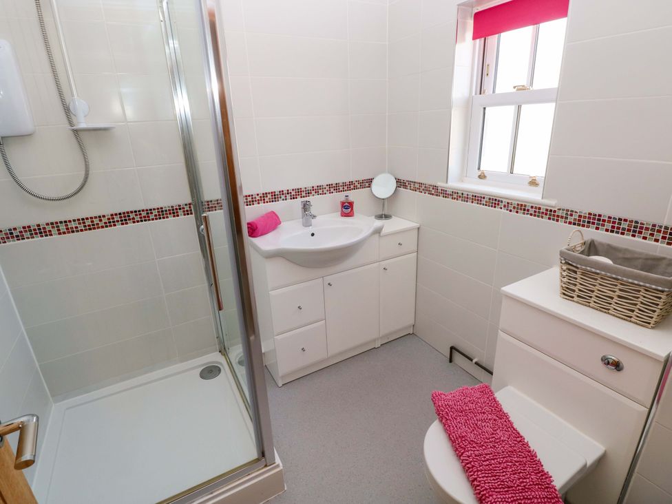 A bathroom with a shower and sink at The Sycamores in Llawhaden near Narberth