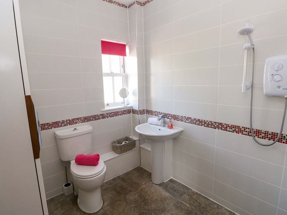 A bathroom with a sink and toilet at The Sycamores in Llawhaden near Narberth