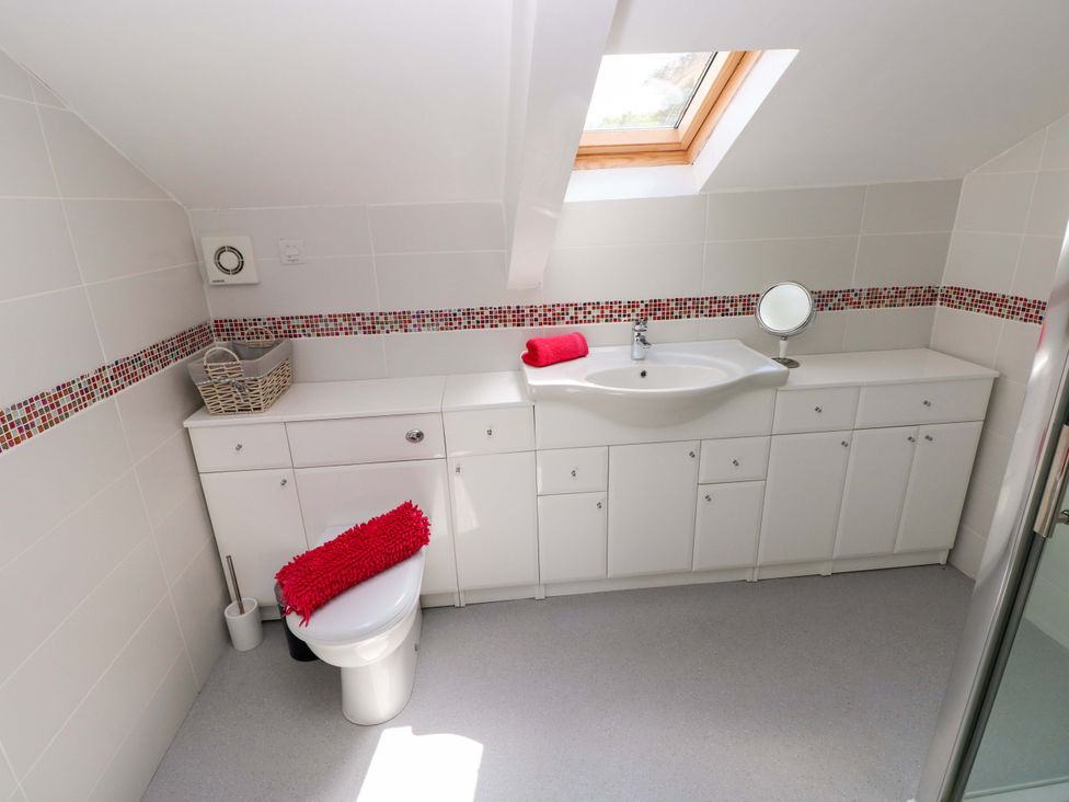 A bathroom with a sink and toilet at The Sycamores Llawhaden near Narberth