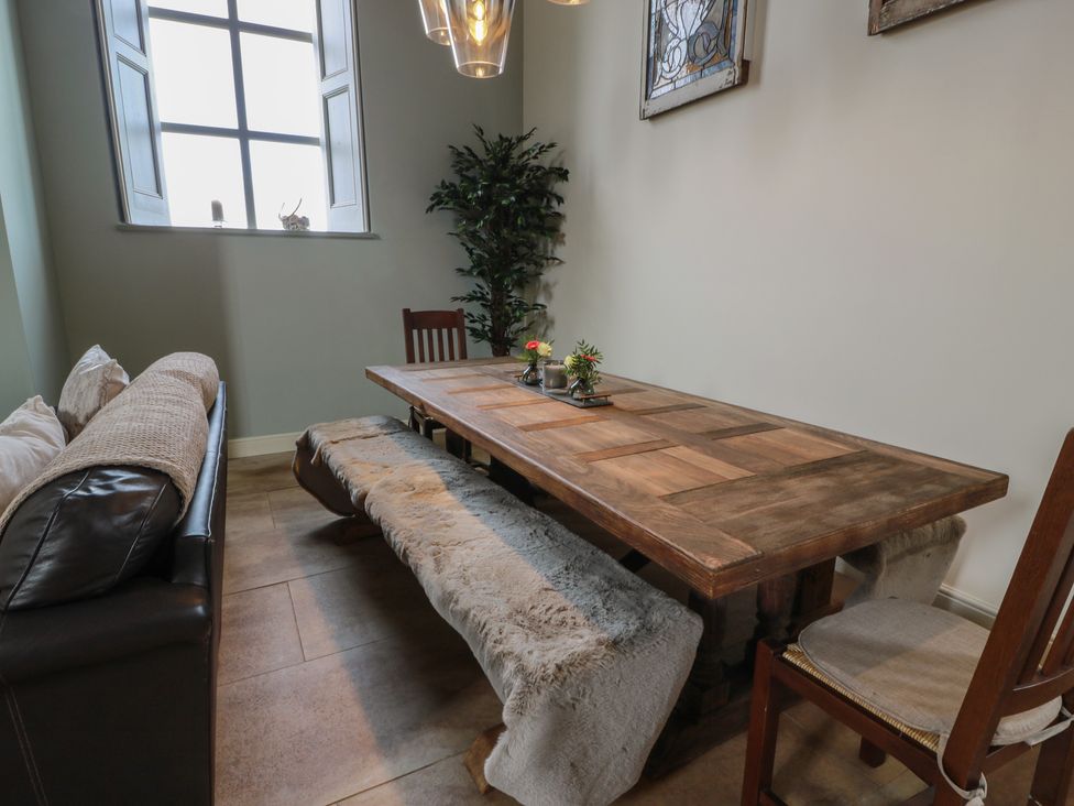 A dining room with table and chairs at The Old Chapel in Norham