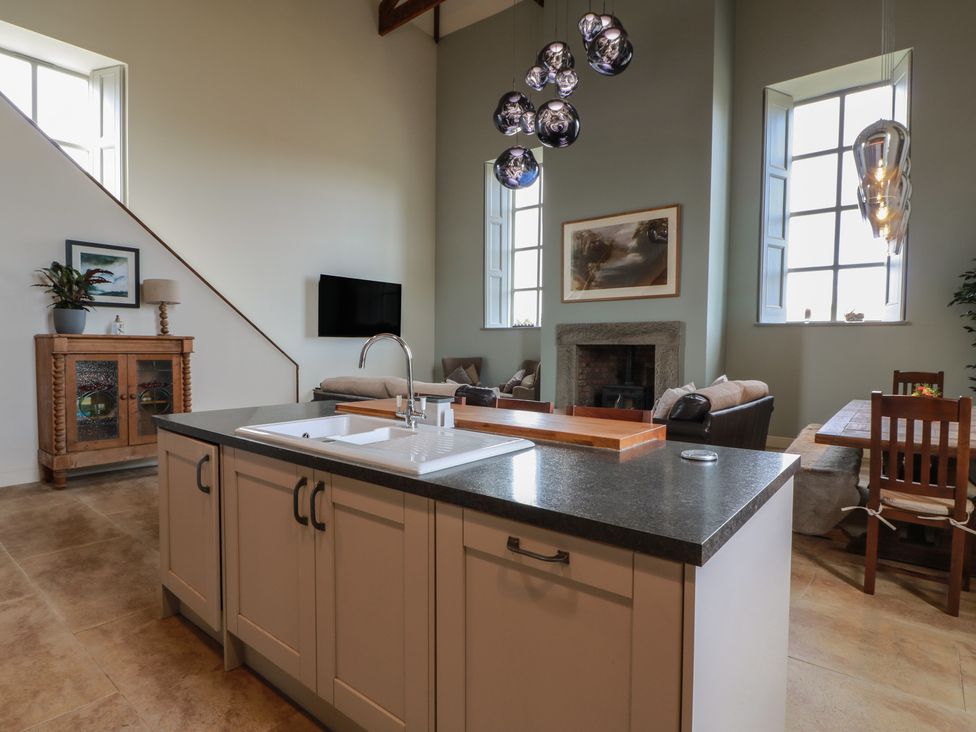 A kitchen with living area and dining area at The Old Chapel in Norham