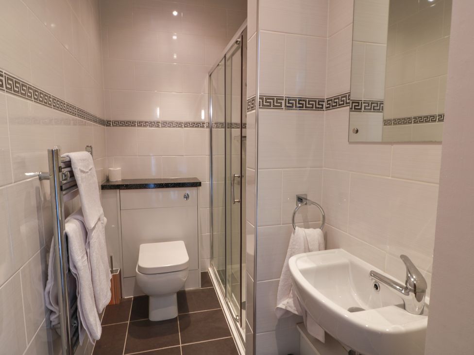A bathroom with toilet, sink, and shower at The Old Chapel in Norham