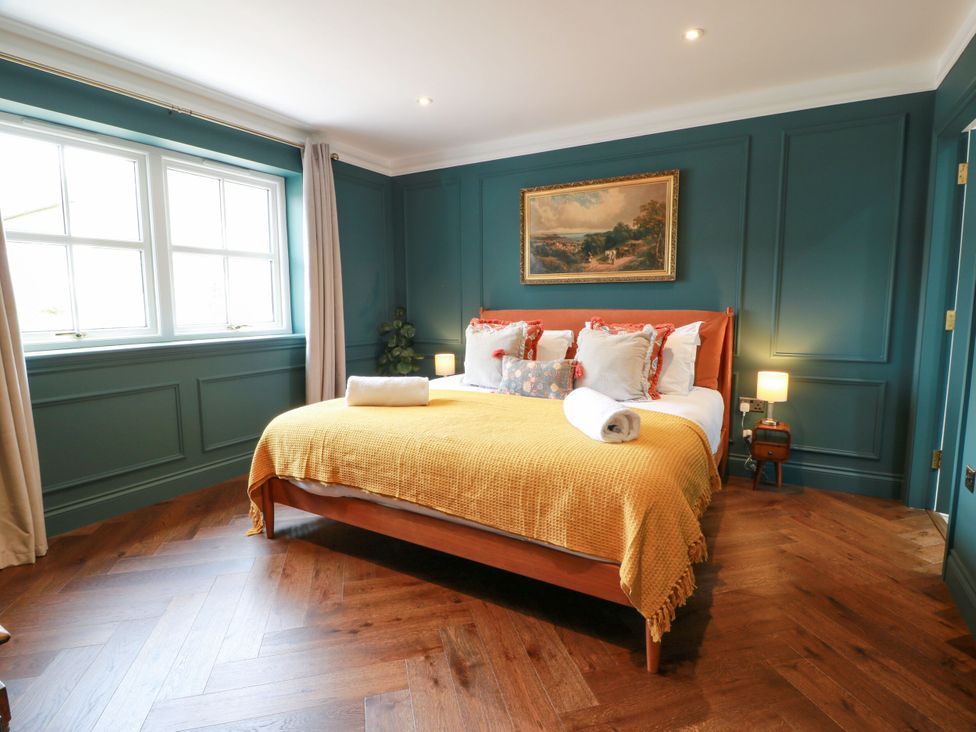 A bedroom with a bed and a window at Riverwood House in Gatehouse Of Fleet