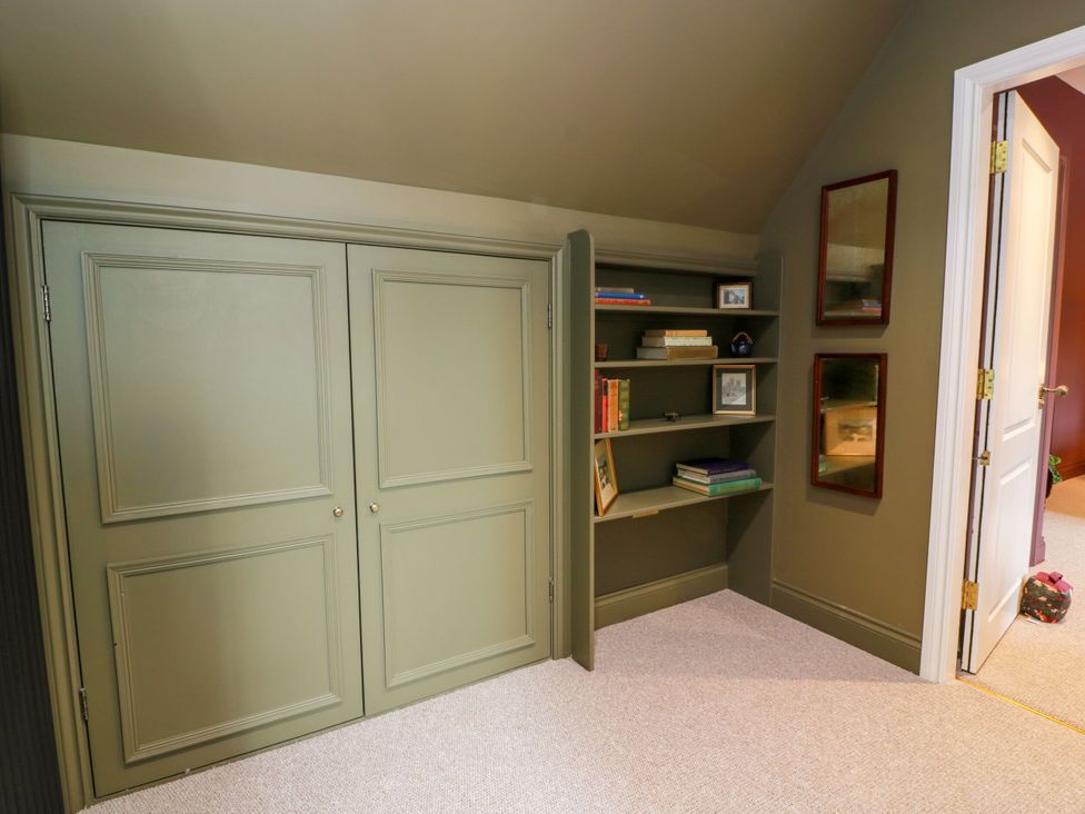 A study with closet and shelves at Riverwood House in Gatehouse Of Fleet