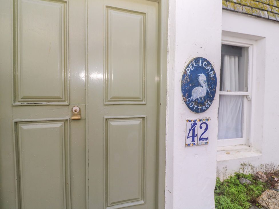 A door and signage at Pelican Cottage in St Ives