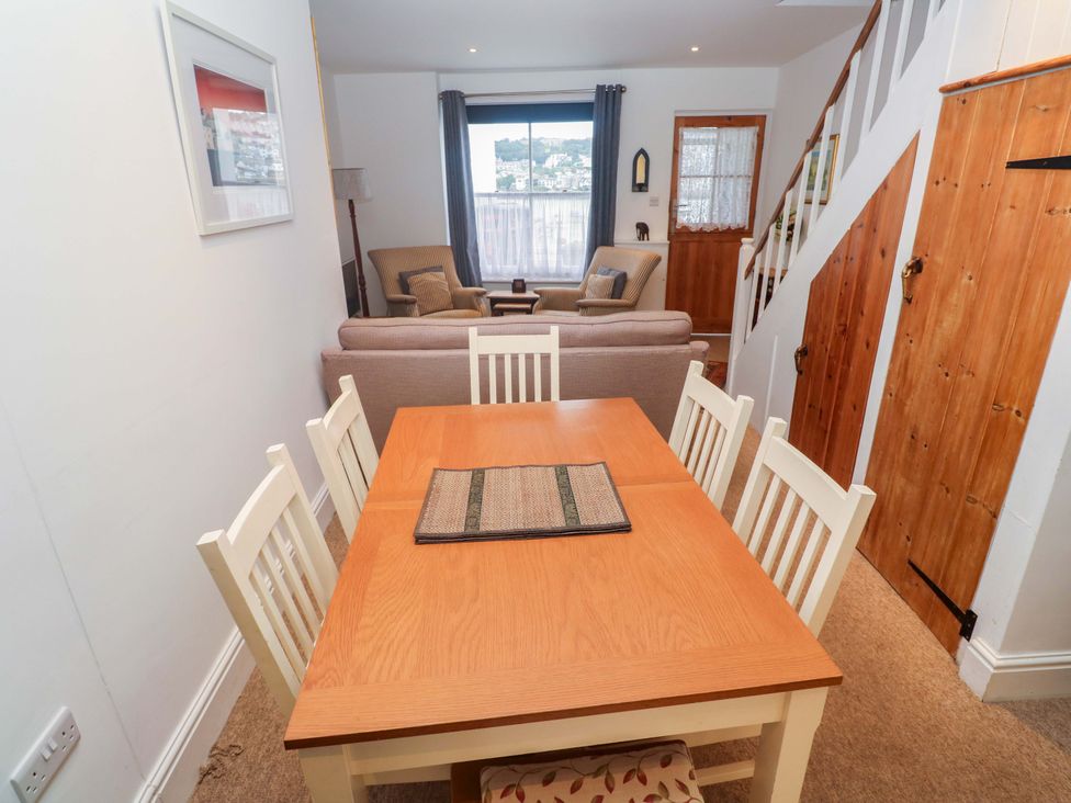 A dining room with a table and chairs at Pelican Cottage in St Ives