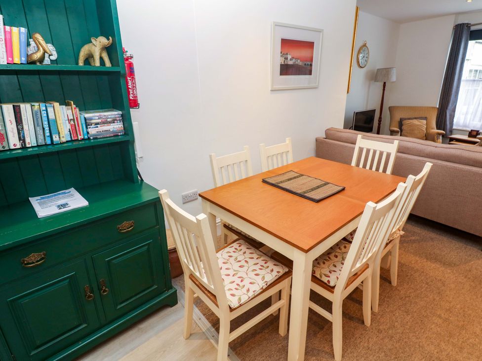 A dining room with a table and chairs at Pelican Cottage in St Ives