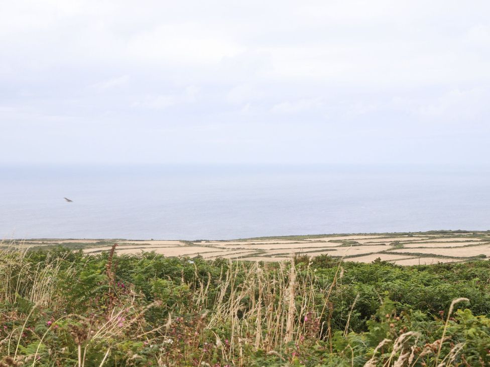 A landscape view of the ocean and fields at Crows Nest in St Ives
