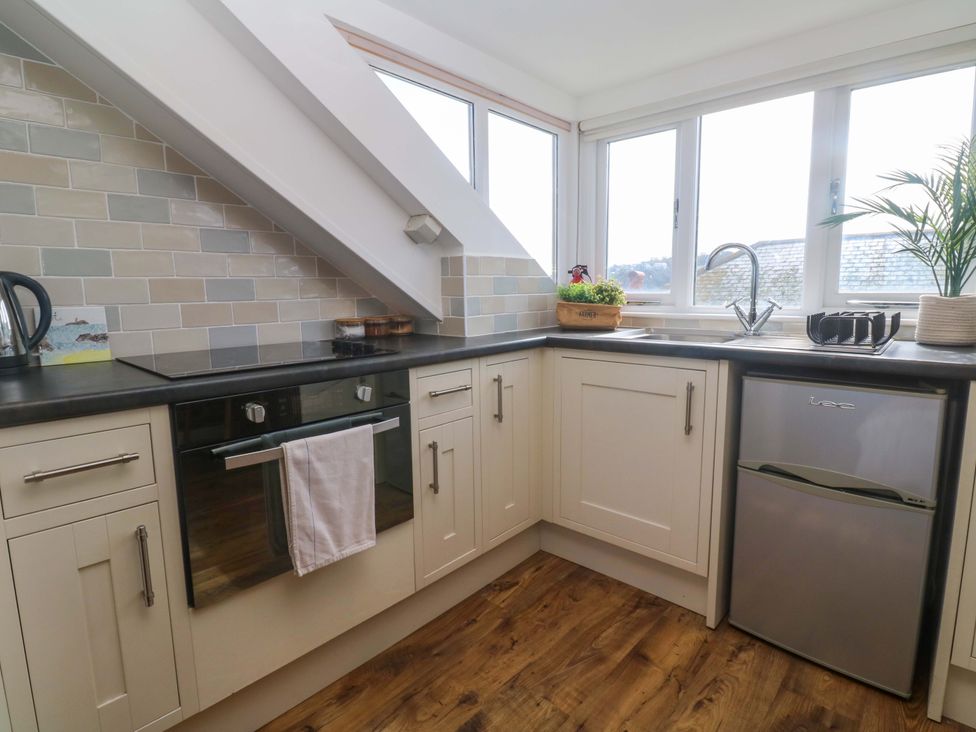 A kitchen with a sink and appliances at Seagulls Nest in St Ives