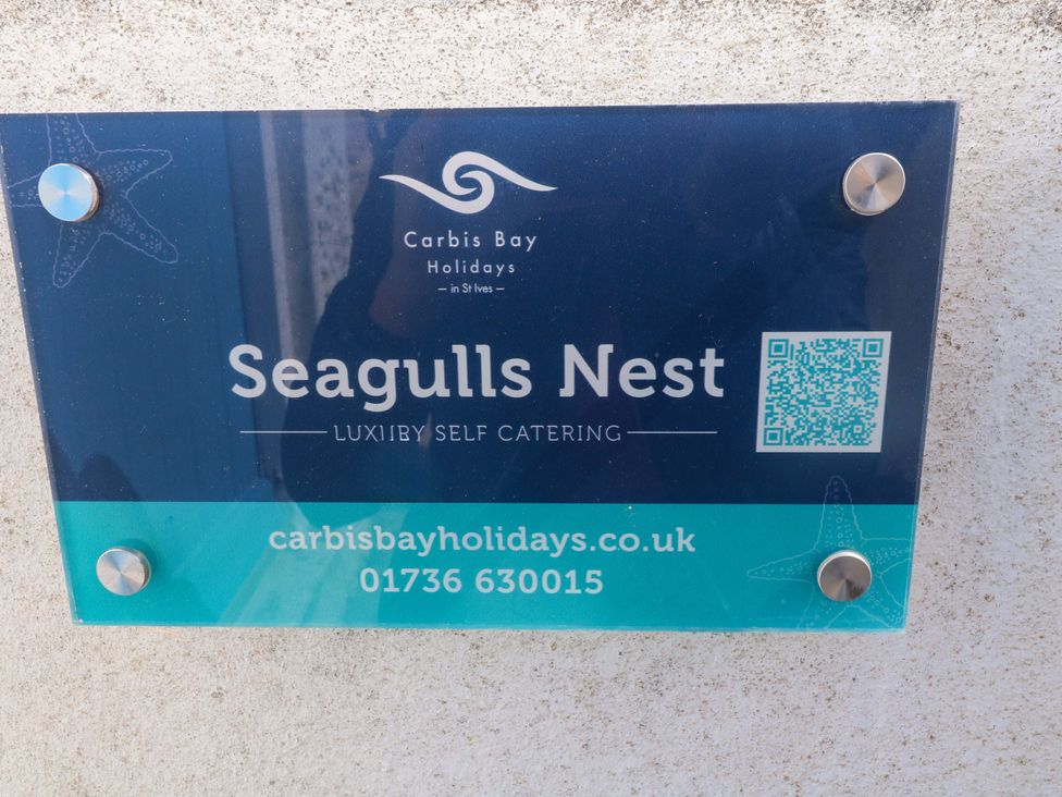 A sign for Seagulls Nest self catering at Carbis Bay Holidays in St Ives