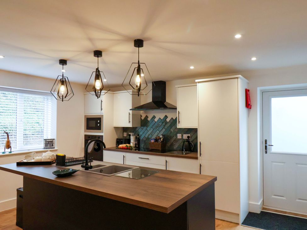 A kitchen with an island and appliances at Sandy Nook in Redcar