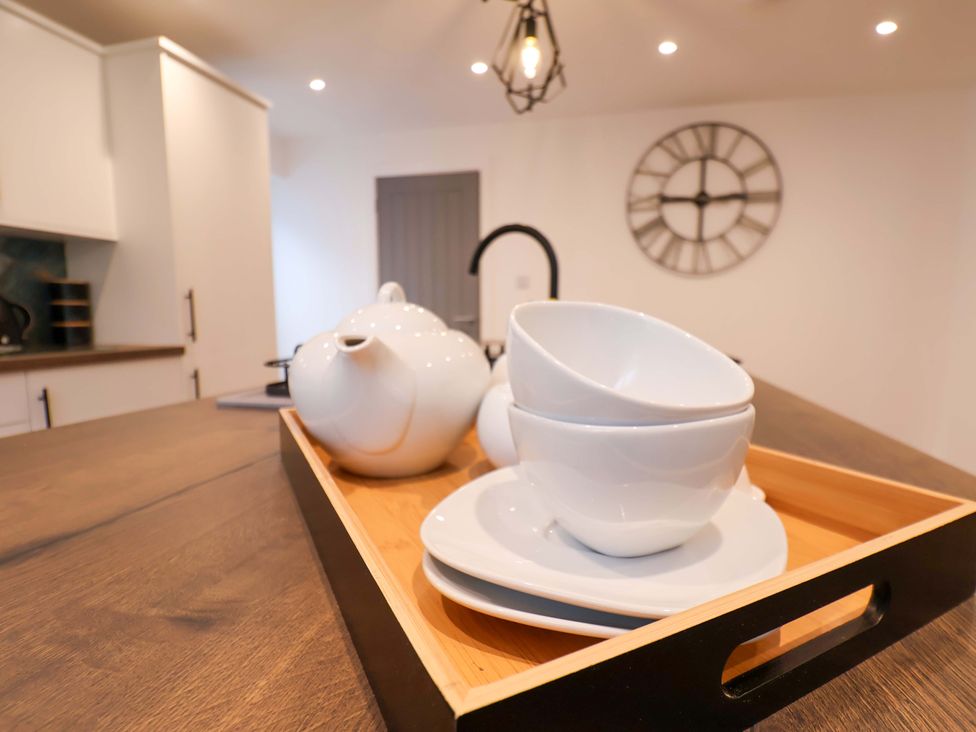 A teapot and cups on a tray in the kitchen at Sandy Nook in Redcar
