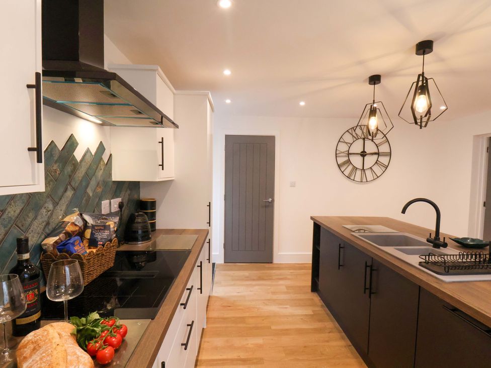 A kitchen with counter and appliances at Sandy Nook in Redcar