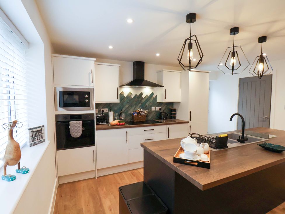 A kitchen with an island and appliances at Sandy Nook in Redcar