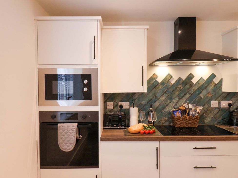 A kitchen with appliances and countertop items at Sandy Nook in Redcar