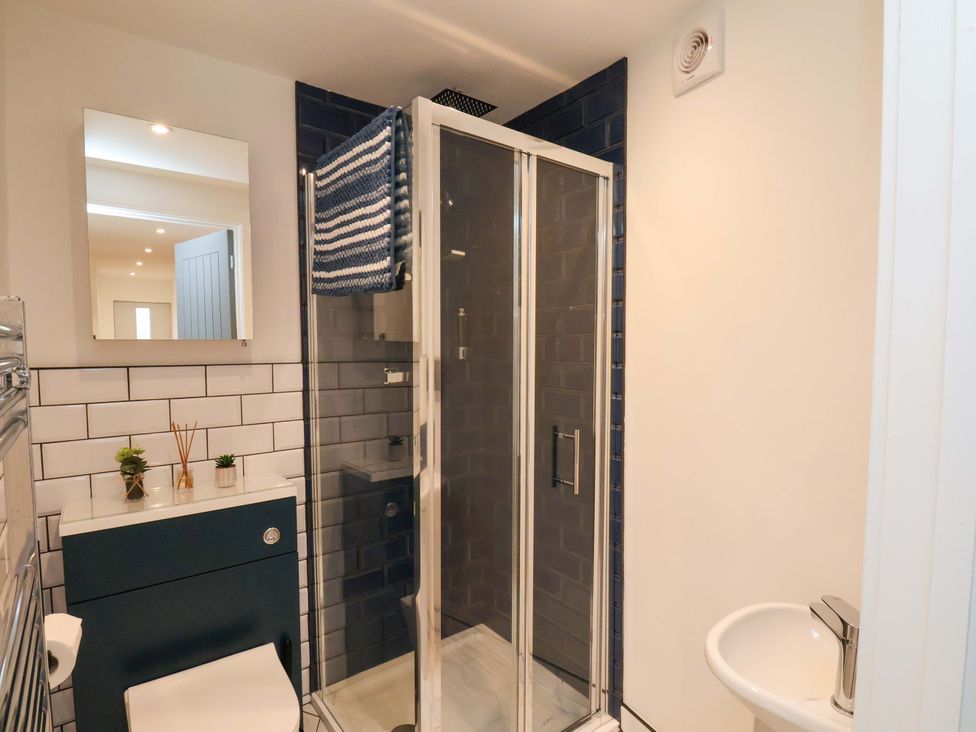 A bathroom with shower and sink at Sandy Nook in Redcar