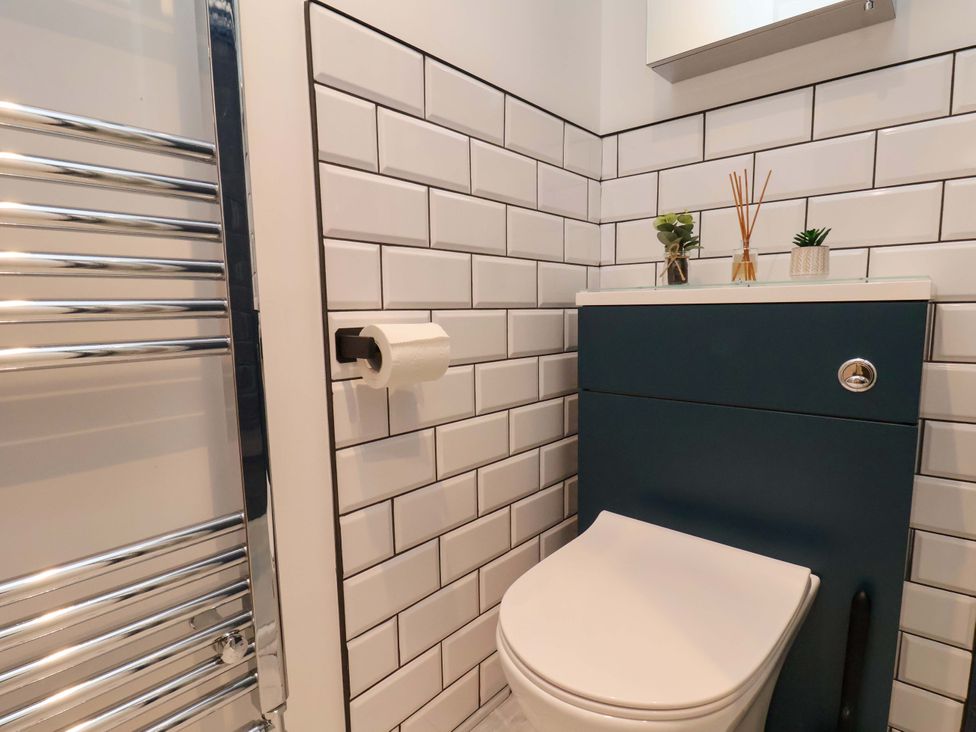 A bathroom with a toilet and towel radiator at Sandy Nook in Redcar
