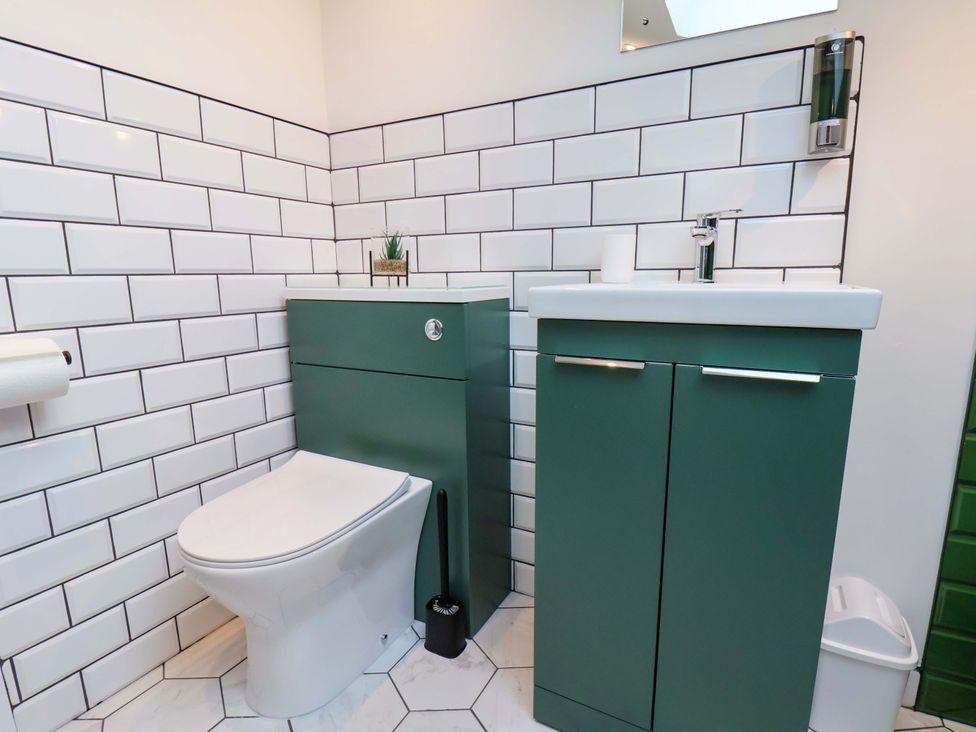 A bathroom with a toilet and sink at Sandy Nook Redcar
