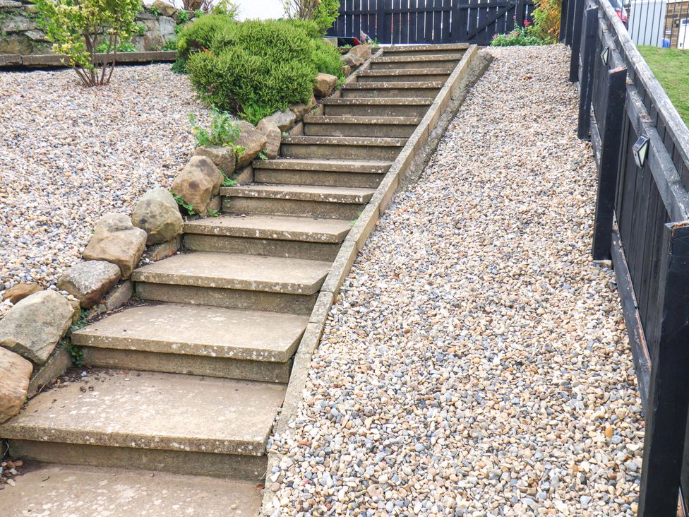 A pathway with steps leading through a garden at Sandy Nook in Redcar