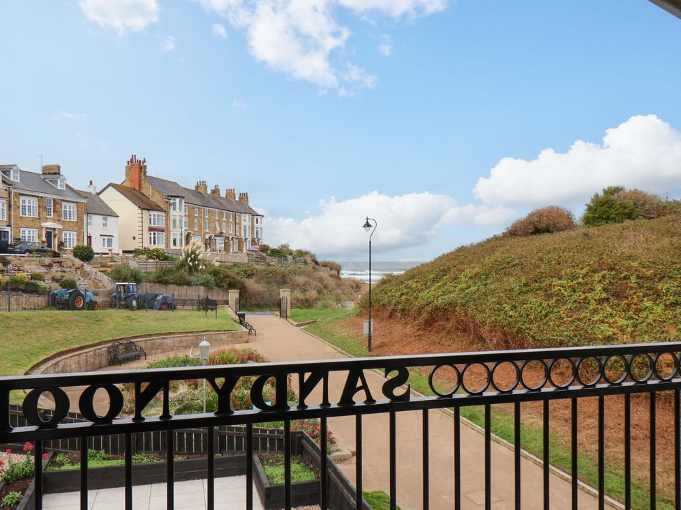 An outdoor view with houses and a pathway at Sandy Nook in Redcar