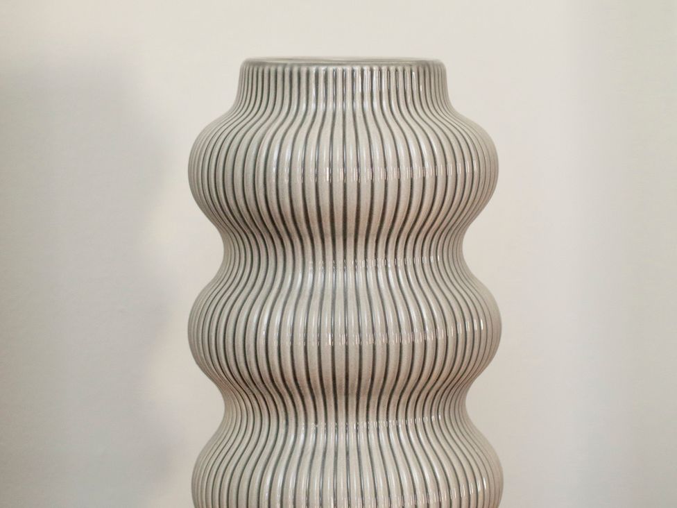 A decorative vase with a wavy design at Apartment 2, 86 Dyer Street Cirencester
