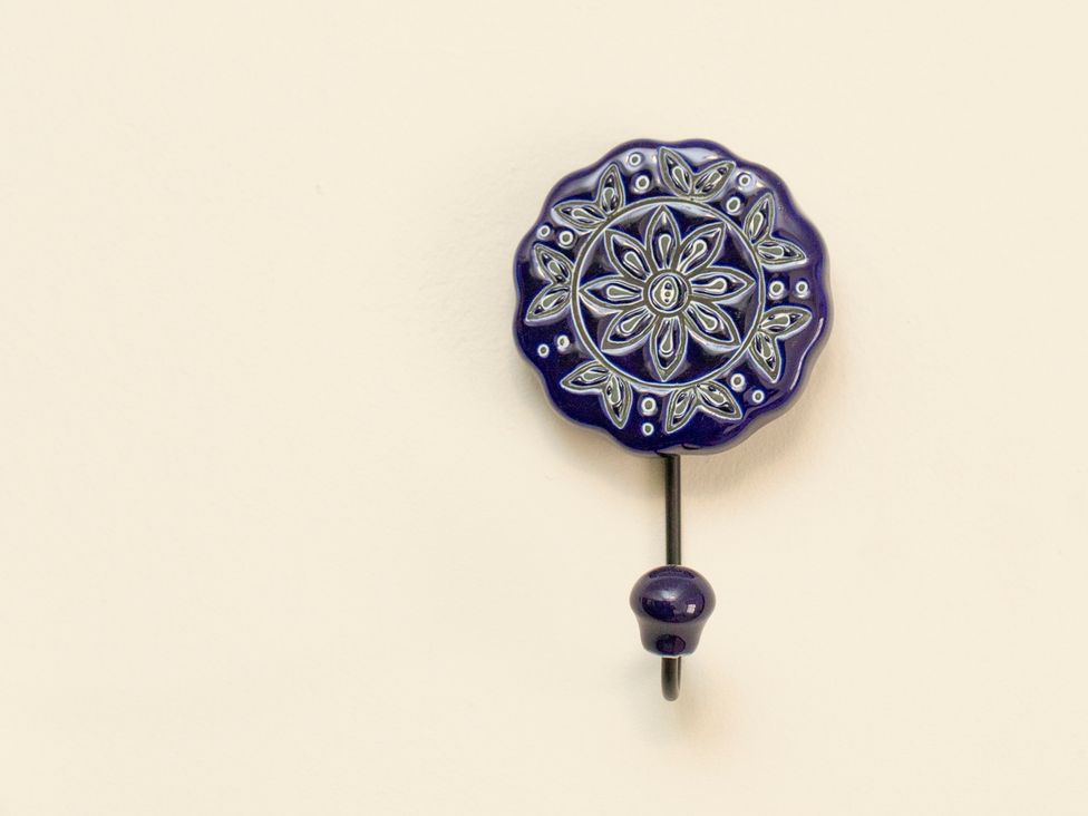 A decorative hook on a wall at Apartment 2, 86 Dyer Street Cirencester
