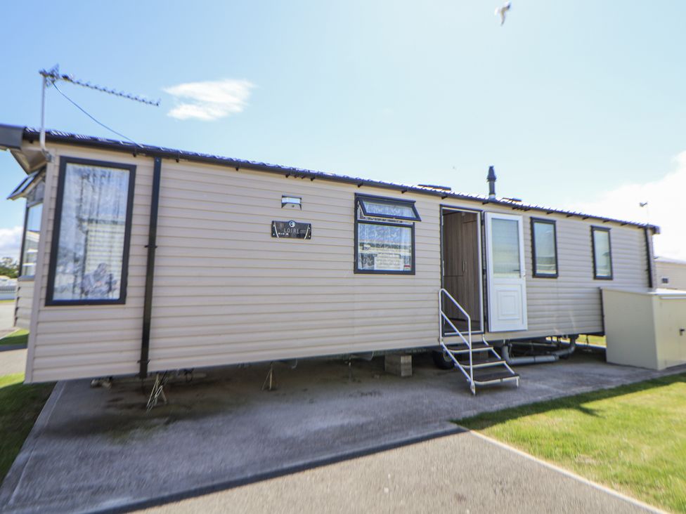 A caravan with windows and a door at V9 Ty Mawr Holiday Park