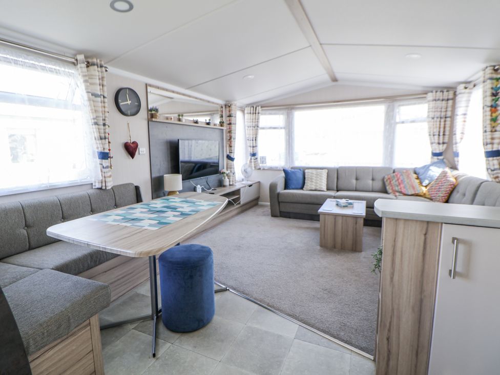 A living room with sofas and a coffee table at V9 Ty Mawr Holiday Park