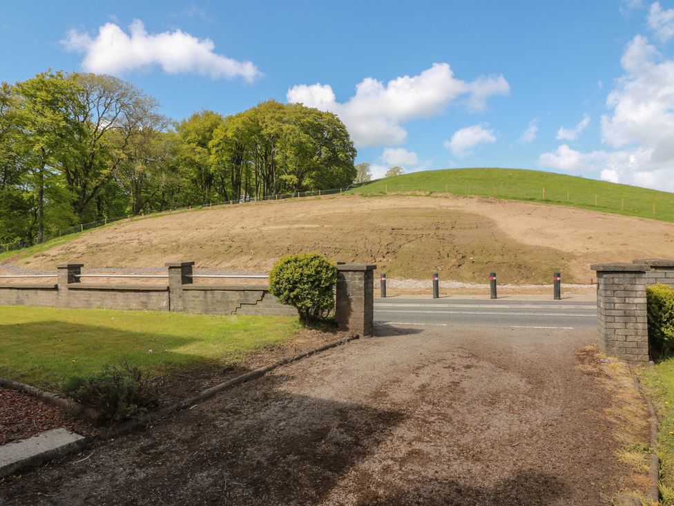A landscape view with trees and a hill at Sundale in Strathaven