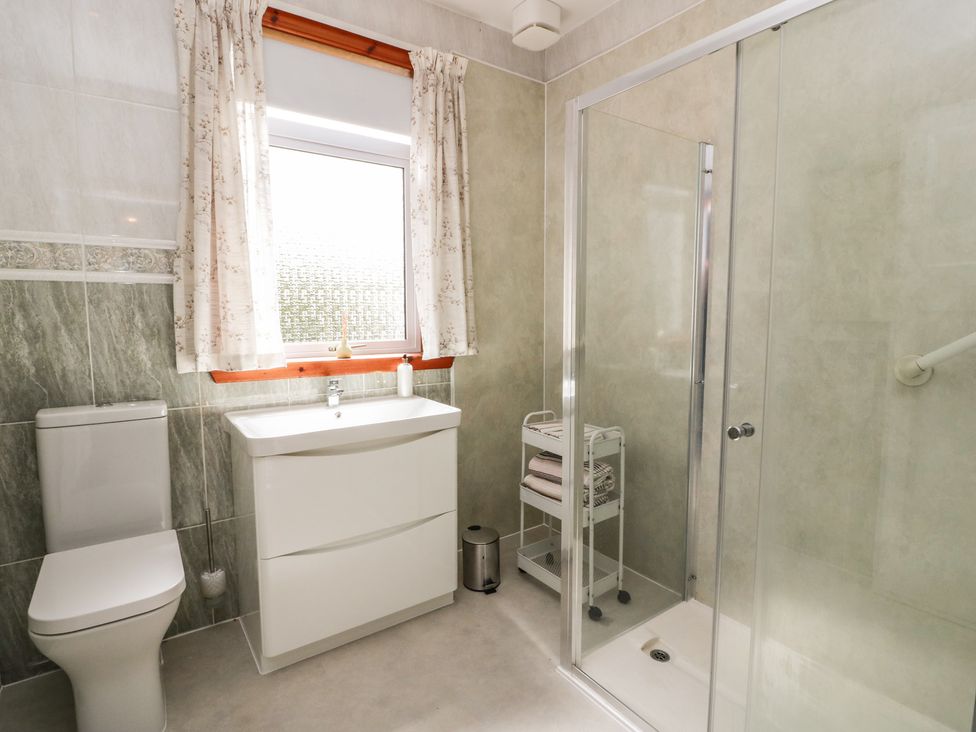 A bathroom with a shower and sink at Sundale in Strathaven