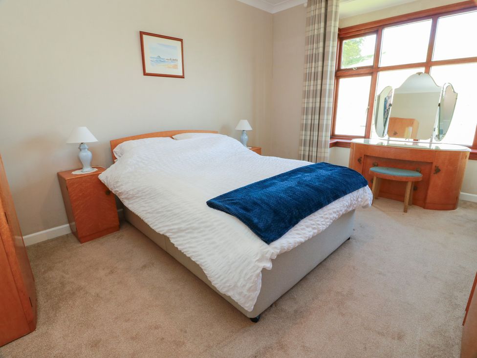 A bedroom with a bed and a dresser at Sundale in Strathaven