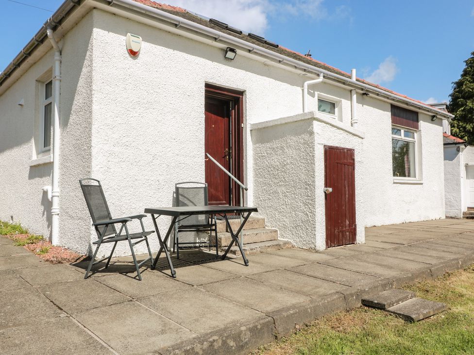 A house exterior with a table and chairs at Sundale in Strathaven