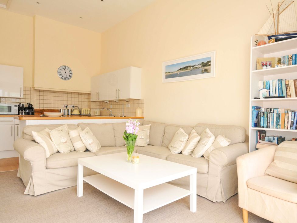 A living room with a sofa and coffee table at 9 Slipway Cottages Rock