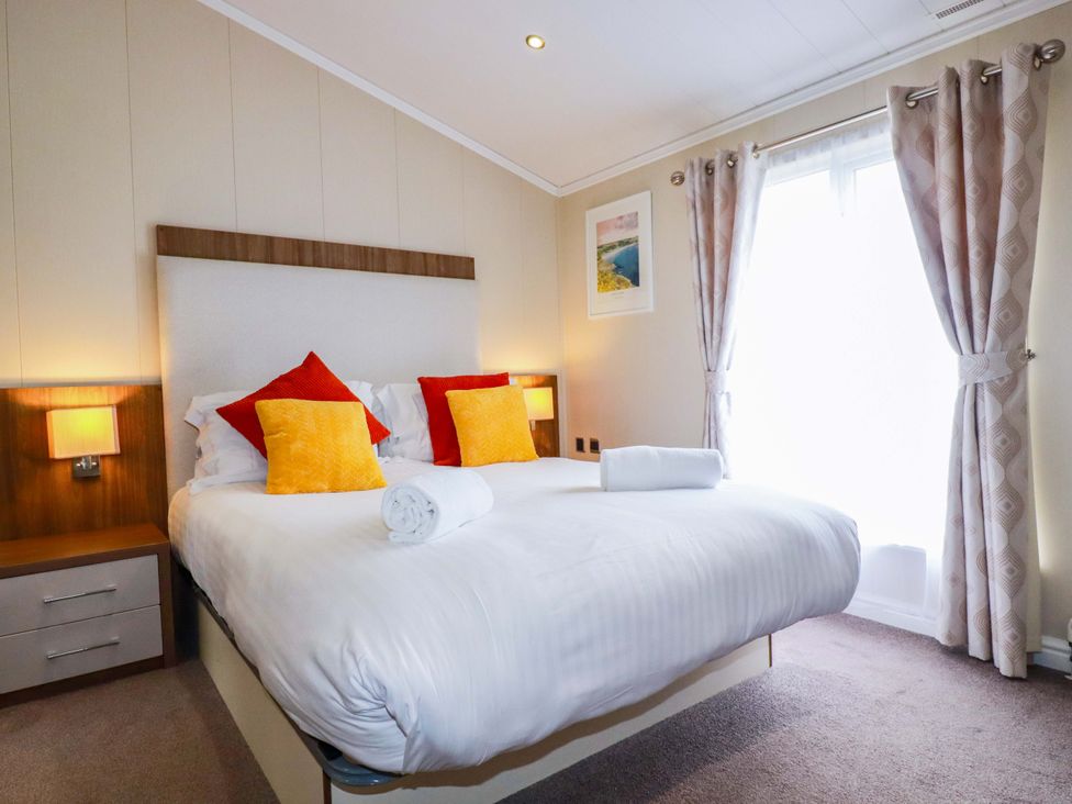 A bedroom with a bed and pillows at The Maples 44 St. Austell