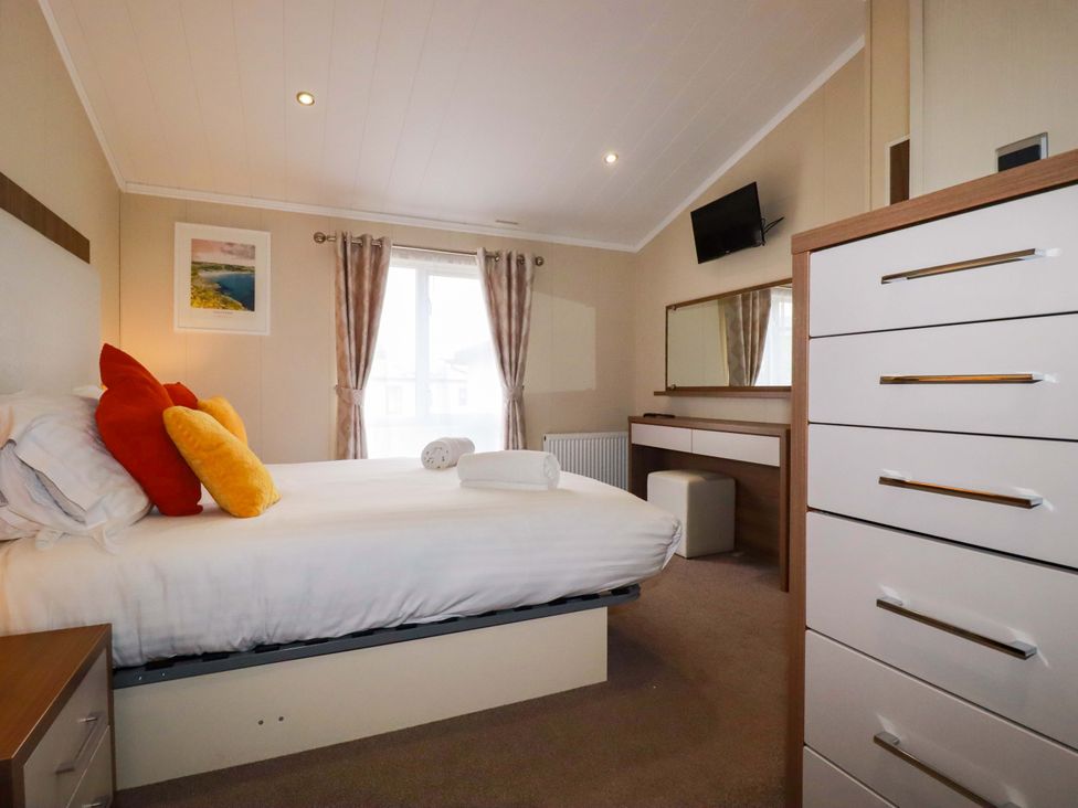 A bedroom with a bed and pillows at The Maples 44 St. Austell