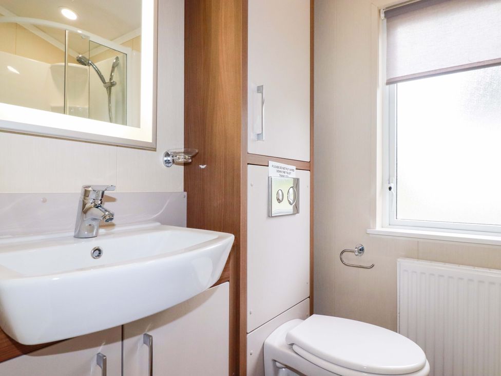 A bathroom featuring a sink, toilet, and shower at The Maples 44 St. Austell