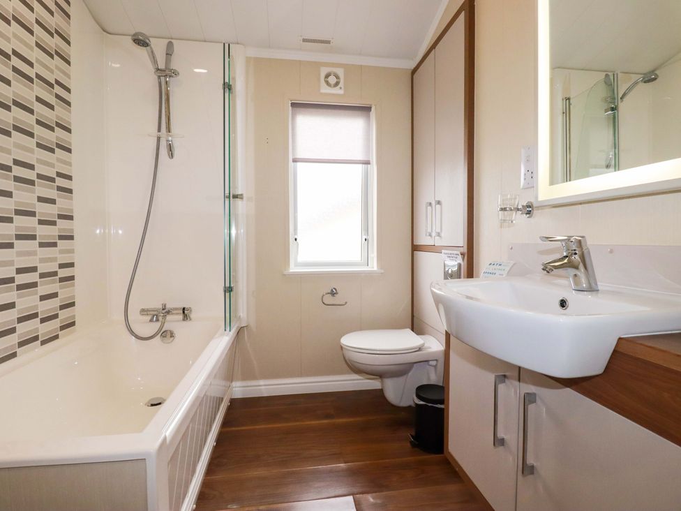 A bathroom with a bathtub and sink at The Maples 44 St. Austell