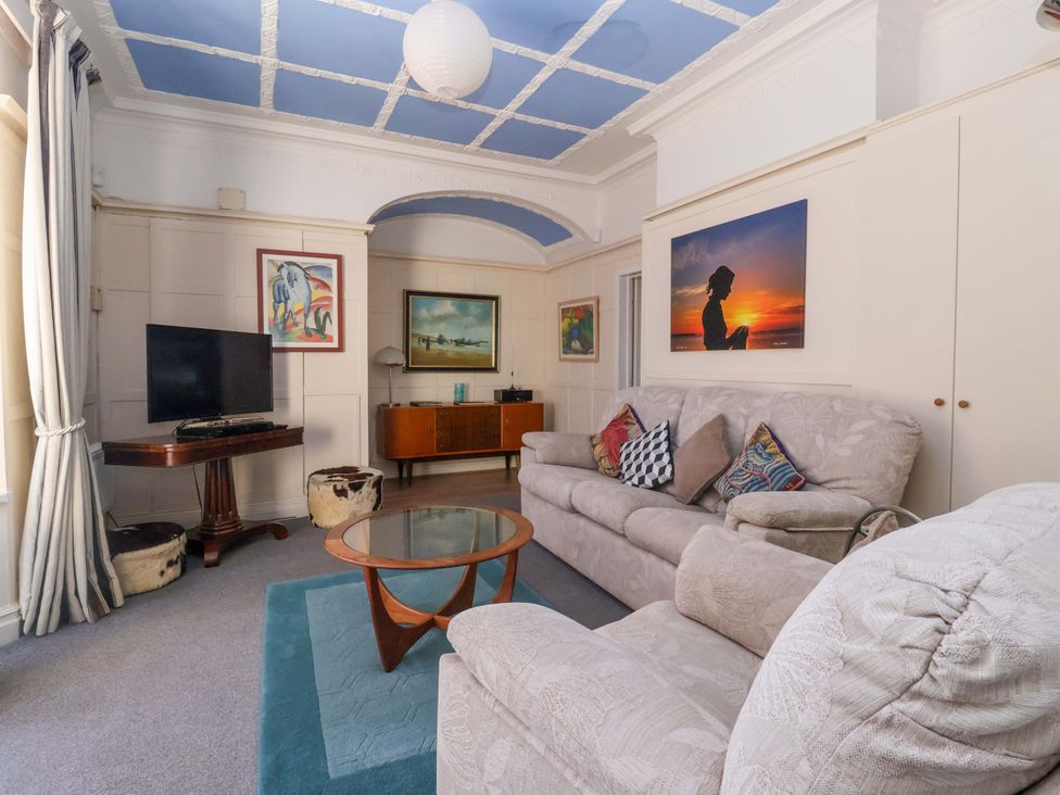 A living room with a sofa and television at Sandy Shore in Bridlington