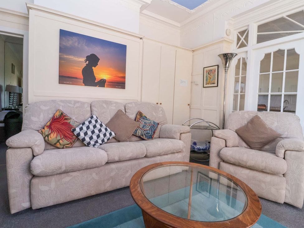 A living room with a sofa and armchair at Sandy Shore in Bridlington