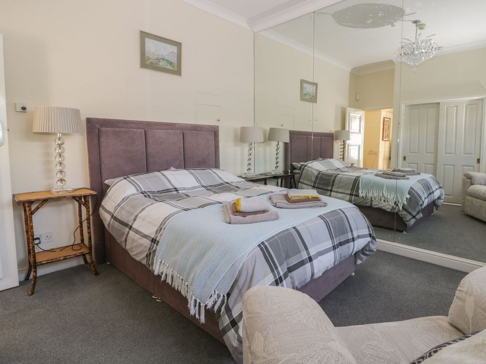 A bedroom with a bed and bedside tables at Sandy Shore in Bridlington